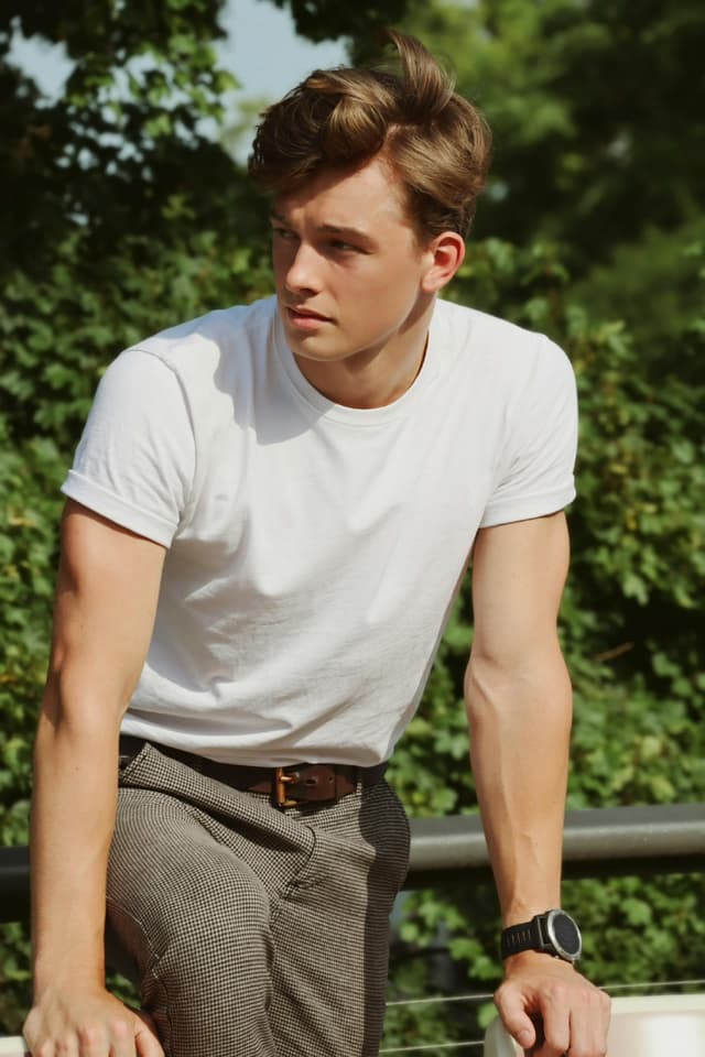 Man in white shirt and pants